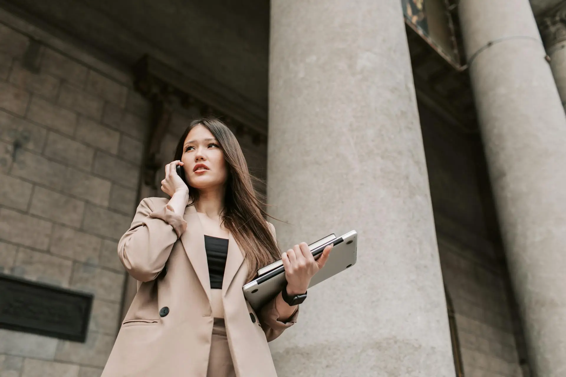 Female real estate analyst outside building